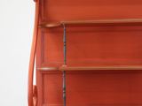 a red cabinet with a glass door on it