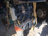 a motor that is sitting on a stand in a garage
