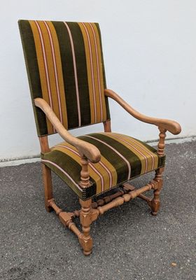 striped upholstered arm chair with wood frame and arms
