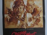une vieille affiche de cinéma représentant deux hommes brandissant des armes l'un face à l'autre