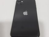the back of a black iphone with a silver apple logo on it