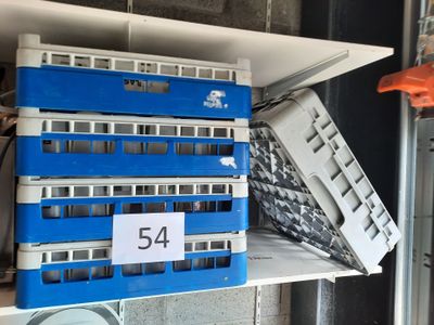 a blue and white bus that is sitting on a shelf