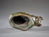 a bronze pipe that is sitting on a table