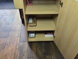 a person standing in a room with a wooden floor