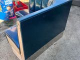 a blue chair that is sitting on the ground