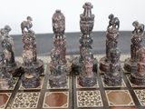 a lot of chess pieces that are on the table