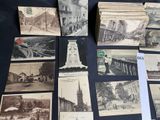 many old postcards on a table with pictures of buildings