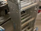 a metal rack that has a bunch of wheels attached to it