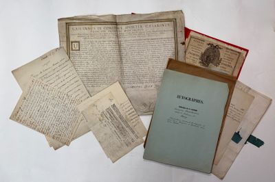 a pile of old papers sitting on a table