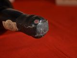 a close up of a bottle of wine on a red cloth