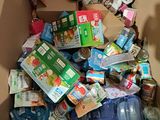 a cardboard box filled with lots of food and drinks