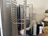 a metal rack with a bunch of trays on it