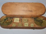 a wooden case that has a lot of different items inside of it