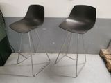 two black stools sitting next to each other in a room