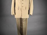 an image of a suit on a mannequin stand on a gray background
