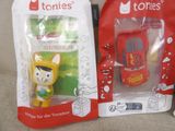 two toys that are in the packaging on the couch