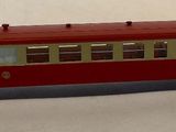 a toy train on a white surface with a white background