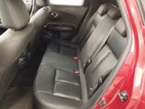 a red car with black seats in the back of it