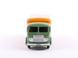 a green toy truck with an orange top on a white surface