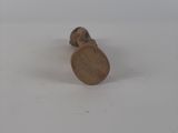 a small wooden object that is sitting on a white surface