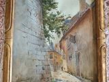 une image représentant un tableau d'une ruelle étroite, dans un cadre doré