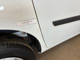 a white car with a sticker on the side of it ' s door