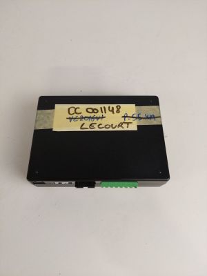a close up of a small electronic device on a white surface