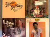 three lp ' s from the early 1970s ' s, including the cover of the album, are on display