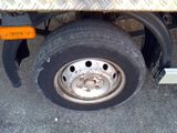a flat tire on the flatbed of a truck
