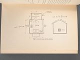 an open book with a drawing of a house on it