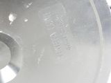 a close up of a circular saw blade on a white surface