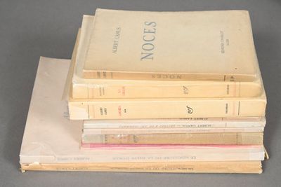 four books stacked on top of each other on a table