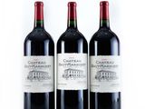 three bottles of wine that are sitting on a table