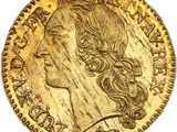 gros plan d'une pièce d'or portant un visage de femme