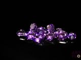 purple amethorate crystals on a black background