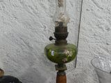 a lamp that is sitting on a table next to a vase