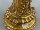 an image of a gold plate with a bird on it