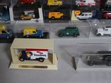 a lot of toy cars that are in a display case