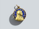 a gold and blue enamel pendant with a head of a man
