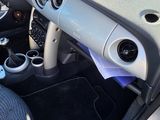 a small car with a steering wheel and a dash board