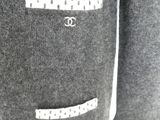chanel logo on a grey sweater with white stitching
