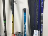 many different types of fishing rods and reels on the wall