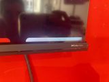 the flat screen tv is mounted on the wall in the living room