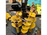 an image of a yellow machine is parked in a lot