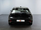 the rear end of a black car in a white room