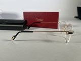 a pair of glasses sitting on a table next to a red box