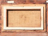 an old picture frame with a piece of wood in it