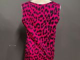 a pink and black leopard print top on a mannequin dummy