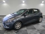 the blue car is parked in the garage on a checkered floor