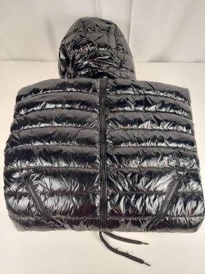 a close up of a black down jacket with a hood